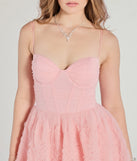 The Jayla Floral Rosette A-Line Ball Gown in luxe pink fabric, a stunning prom dress with statement details designed to make a bold impression at Prom 2025.