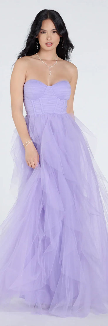 Own the spotlight in the Lindsey Bustier A-Line Ruffle Tulle Ball Gown, a lavender formal dress crafted to deliver luxe style for summer weddings, Army Balls, or any special event.