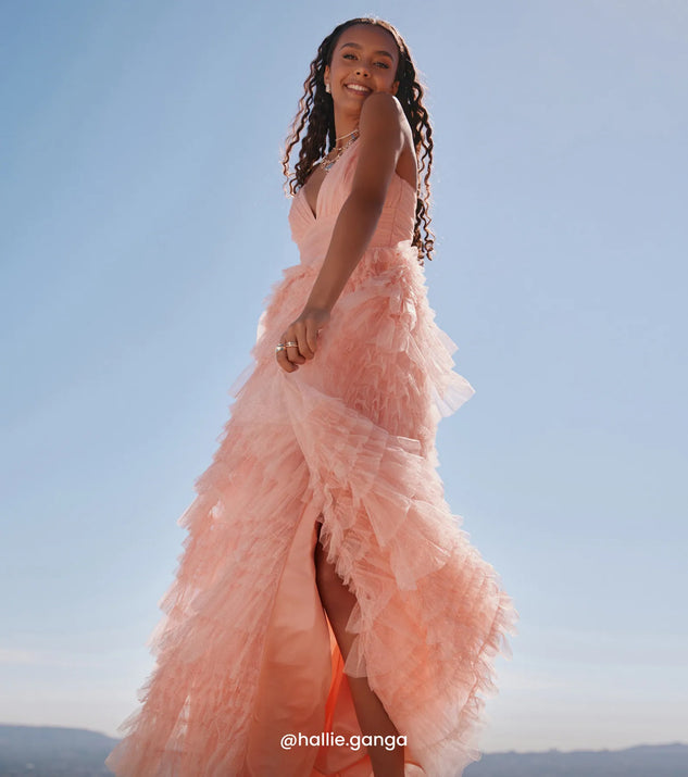 Make a bold statement in the Amabella Ruffled Glitter Tulle Ball Gown in coral, the perfect spring dress for weddings, cocktail hours, nights out, and/or seasonal celebrations.