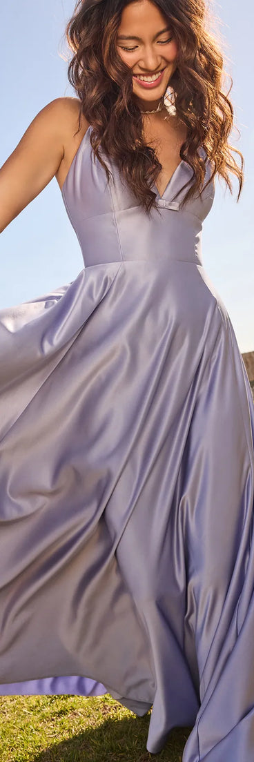 Own the spotlight in the Daniela Satin A-Line Ball Gown, a periwinkle formal dress crafted to deliver luxe style for autumn weddings, Military Balls, or any special event.