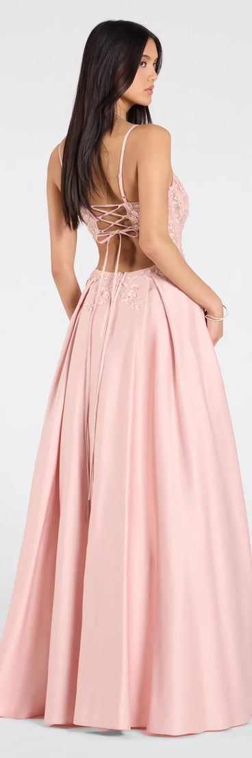 Make a bold statement in the Paloma Corset Applique A-Line Satin Ball Gown in pink, the perfect spring dress for weddings, cocktail hours, nights out, and/or seasonal celebrations.