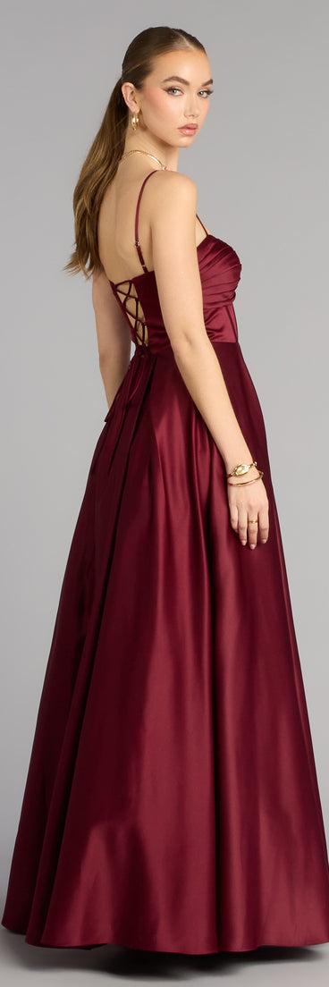 Style a ball gown like the Gracelyn Satin Corset A-Line Gown in wine designed with a full skirt, defined waist, and refined finish for special occasions.