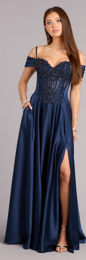 Pick a ball gown from Windsor for your next formal event or special occasion like the Ava Satin Cold Shoulder A-Line Ball Gown in navy blue, featuring a voluminous silhouette, structured bodice, and elegant detail.