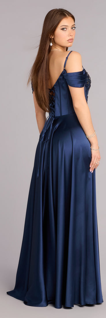 Style a ball gown like the Ava Satin Cold Shoulder A-Line Ball Gown in navy blue designed with a full skirt, defined waist, and refined finish for special occasions.