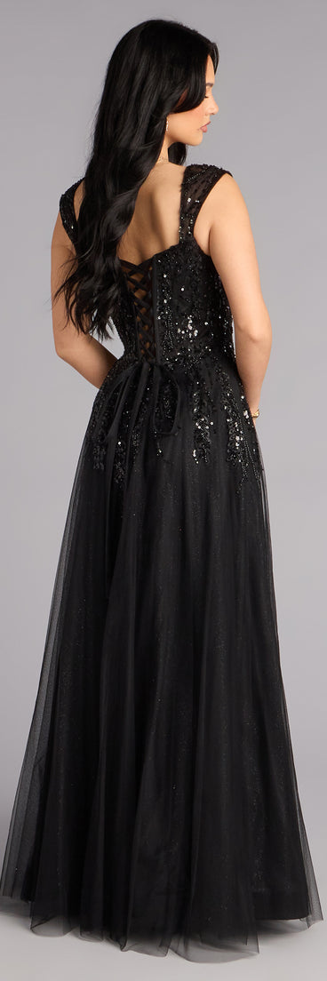 Style a ball gown like the Ashley Applique Lace-Up Tulle Ball Gown in black designed with a full skirt, defined waist, and refined finish for special occasions.
