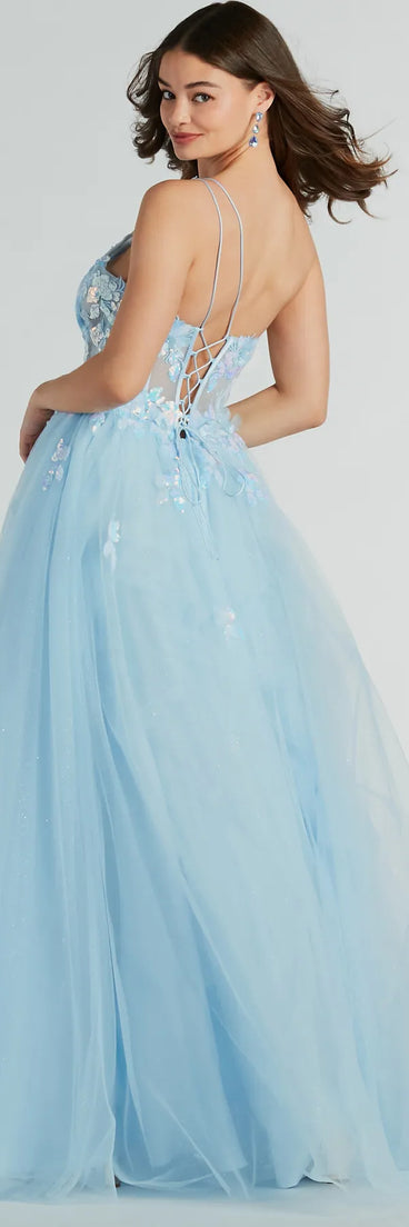 Stand out in a crowd with the Arie Floral Applique Sequin A-Line Ball Gown, a glamorous multicolor sequin dress that sparkles effortlessly as an NYE party gown, wedding guest dress, or must-have evening wear for formal events like military balls and winter formals.