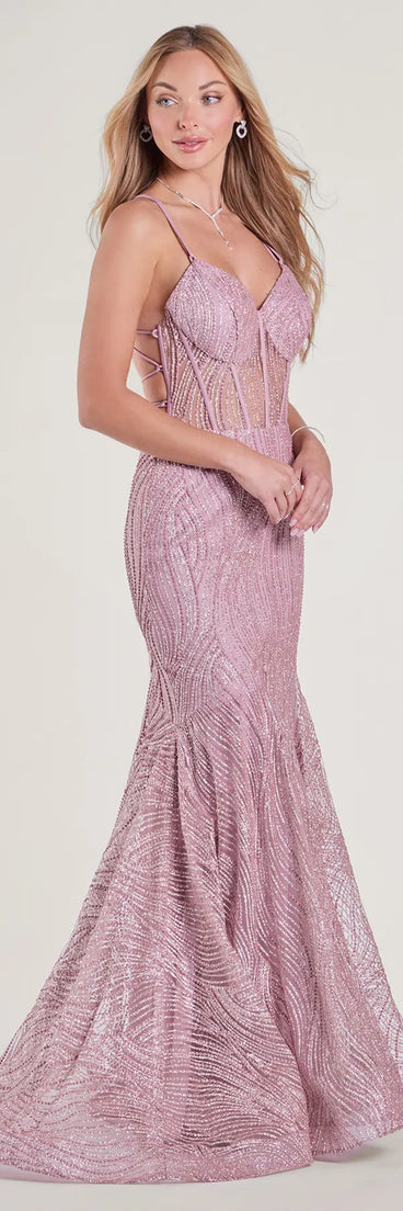 The Loreli Lace-Up Glitter Striped Mermaid Gown in luxe pink fabric, a stunning prom dress with statement details designed to make a bold impression at Prom 2025.