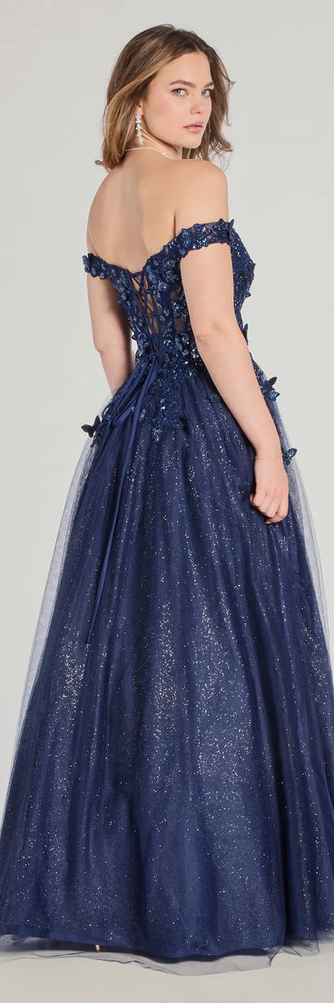 Step into the Prom 2025 dance in the Sofia Off-The-Shoulder Corset Lace-Up Glitter Ball Gown in navy, a stunning blue prom dress designed to complement any theme with its timeless allure and statement-making style.
