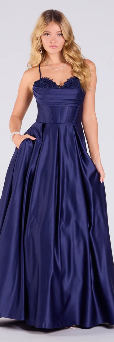 Make a bold statement in the Tessa Corset Lace-Up A-Line Satin Ball Gown in navy blue, the perfect spring dress for weddings, cocktail hours, nights out, and/or seasonal celebrations.