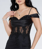 Make a bold statement in the Cleo Floral Embroidered Tulle Corset Mermaid Gown in black, the perfect spring dress for weddings, cocktail hours, nights out, and/or seasonal celebrations.