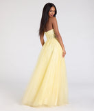 The Gwen Strapless Corset A-Line Glitter Ball Gown in luxe yellow fabric, a stunning prom dress with statement details designed to make a bold impression at Prom 2025.