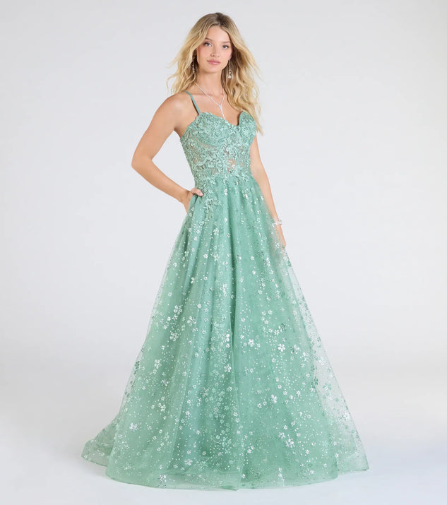 Make a bold statement in the Adrienne Corset A-Line Glitter Mesh Ball Gown in sage green, the perfect green dress for weddings, cocktail hours, nights out, and/or seasonal celebrations.