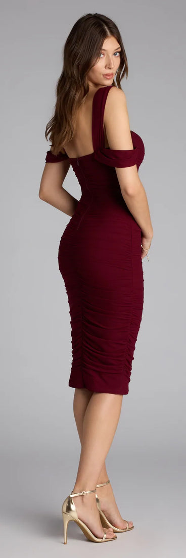 The Stylish Soiree Cold Shoulder Midi Dress in wine features a flattering fit and mid-calf hem, redefining effortless midi dresses for any occasion.