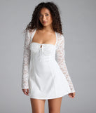 Feel confident and photo-ready in the Flirty Factor Lace Long Sleeve Crepe Mini Dress, a white graduation dress perfect for 2025 ceremonies and parties.
