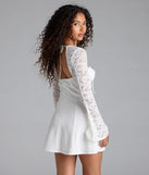 The Flirty Factor Lace Long Sleeve Crepe Mini Dress in white brings sleek style to any graduation outfit, from cap and gown to after-party.