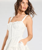 Make a bold statement in the Playful Flirt Lace-Up Ruffle Skater Dress in white, the perfect spring dress for weddings, cocktail hours, nights out, and/or seasonal celebrations.