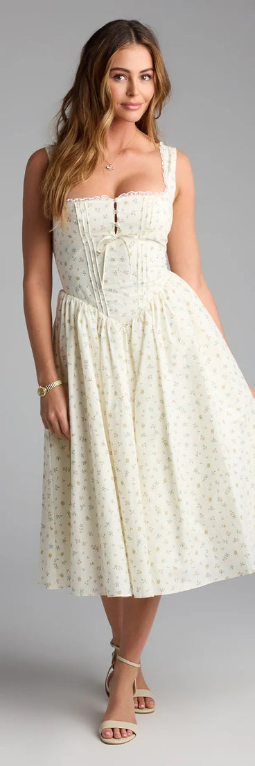 The Soft Girl Floral Drop Waist Midi Dress in yellow features a flattering fit and mid-calf hem, redefining effortless midi dresses for any occasion.