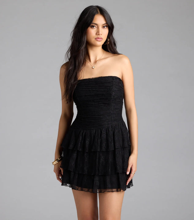 Step into summer looking effortlessly chic in the Lovely Nights Strapless Lace Ruffle Skater Dress in black, a must-have Windsor dress for your warm-weather wardrobe.