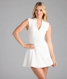 Step into summer looking effortlessly chic in the Classically Sleek Sleeveless A-Line Mini Dress in white, a must-have Windsor dress for your warm-weather wardrobe.