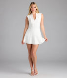 Step into summer looking effortlessly chic in the Classically Sleek Sleeveless A-Line Mini Dress in white, a must-have Windsor dress for your warm-weather wardrobe.