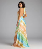 The True Colors Open Back Abstract Satin Maxi Dress is a flowy, green maxi dress that moves with you from sunny days to elevated nights in effortless style.