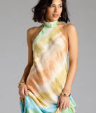The True Colors Open Back Abstract Satin Maxi Dress is a flowy, green maxi dress that moves with you from sunny days to elevated nights in effortless style.