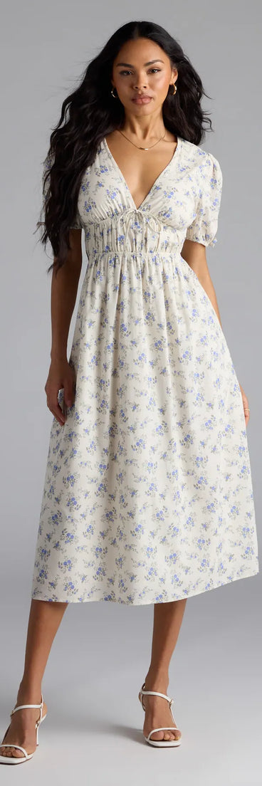 Step into summer looking effortlessly chic in the Summer Smiles Floral Puff Sleeve A-Line Midi Dress in ivory, a must-have Windsor dress for your warm-weather wardrobe.