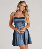 Step into seasonal chic with the A Moment In Satin Skater Dress, a blue mini dress featuring an above-the-knee cut ideal for cocktail parties, festive gatherings, or clubwear.