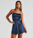 Step into seasonal chic with the Grand Exit Satin Skater Dress, a navy mini dress featuring an above-the-knee cut ideal for cocktail parties, festive gatherings, or clubwear.