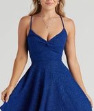The Spectacular Twirl Glitter Skater Dress in blue is an elevated cocktail dress featuring a chic silhouette, perfect for winter cocktail parties and holiday celebrations with trendy seasonal details.