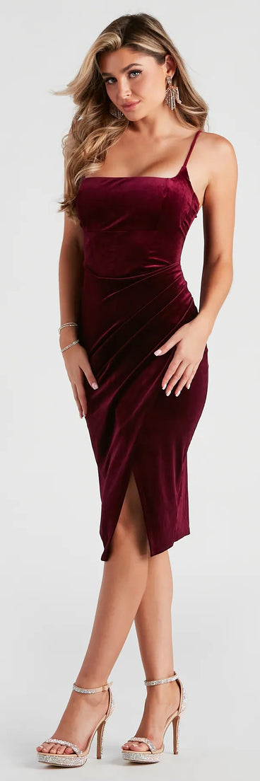 The Absolute Dream Velvet Midi Dress in burgundy is a modern red dress featuring trendy details and a stunning design ideal for wedding guest dresses, elegant cocktail looks, or an alluring Valentine’s Day dress.