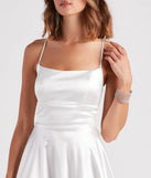 Step into seasonal chic with the A Moment In Satin Skater Dress, a white mini dress featuring an above-the-knee cut ideal for cocktail parties, festive gatherings, or clubwear.