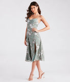 The Garden Chic Floral Chiffon Midi Dress is a sage green midi dress, featuring an elevated midi-length silhouette perfect for wedding guest attire, romantic date nights, or effortless everyday styling.