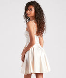 The Dancing Diva Satin Skater Dress is a mini dress in ivory, perfect for an above-the-knee holiday party dress or a stylish NYE look, with a short hemline designed to make a winter statement.