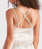 Step into winter chic with the Dancing Diva Satin Skater Dress, a ivory mini dress featuring an above-the-knee cut ideal for cocktail parties, festive gatherings, or clubwear.