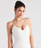 The A Lace Romance V-Neck Strappy Dress is a stylish white lace dress, designed with intricate lace and an alluring silhouette, making it an elegant choice for Valentine's Day, weddings, or effortless spring looks.