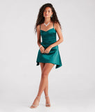 Make a bold statement in the Show Off That Flair Satin A-Line Mini Dress in emerald green, the perfect green dress for weddings, cocktail hours, nights out, and/or seasonal celebrations.