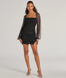 Make a bold statement in the Shimmer Season Long Sleeve Glitter Mini Dress in black, the perfect spring dress for weddings, cocktail hours, nights out, and/or seasonal celebrations.