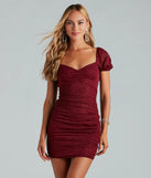 Step into winter chic with the Unreal Shine Glitter Puff Sleeve Mini Dress, a burgundy mini dress featuring an above-the-knee cut ideal for cocktail parties, festive gatherings, or clubwear.