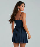 The Ready To Shine Glitter Short Skater Dress is a mini dress in navy, perfect for an above-the-knee holiday party dress or a stylish NYE look, with a short hemline designed to make a winter statement.