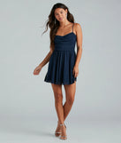 The Ready To Shine Glitter Short Skater Dress is a stunning navy mini dress with a short hem, designed to be the perfect winter cocktail dress or night-out look for the holiday season.