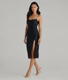 Make a bold statement in the Sleek And Smooth High Slit Midi Dress in black, the perfect spring dress for weddings, cocktail hours, nights out, and/or seasonal celebrations.