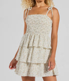 Step into winter chic with the Cascading Romance Ruffle Floral Skater Dress, a ivory mini dress featuring an above-the-knee cut ideal for cocktail parties, festive gatherings, or clubwear.