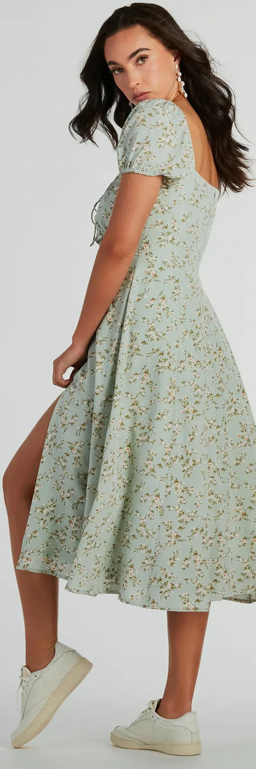 Essential for vacations or summer days, the RSVP To Cute Ditsy Wildflower Tie A-Line Midi Dress is a sundress or milkmaid dress with sleek and flirty details.