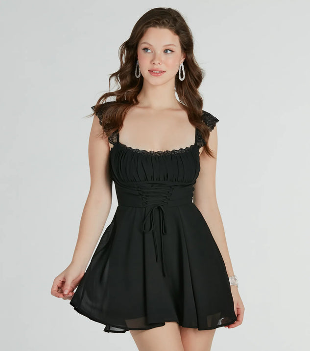 Step into seasonal chic with the Dainty-Chic Lace-Trim Woven Corset Skater Dress, a black mini dress featuring an above-the-knee cut ideal for cocktail parties, festive gatherings, or clubwear.