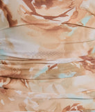 The Admiring Muse Sleeveless Bodycon Floral Midi Dress in taupe is an elevated cocktail dress featuring a chic silhouette, perfect for winter cocktail parties and holiday celebrations with trendy seasonal details.