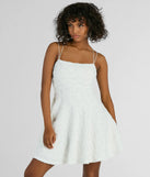 Step into winter chic with the Whimsical Beauty Strappy Back Textured Knit Skater Dress, a white mini dress featuring an above-the-knee cut ideal for cocktail parties, festive gatherings, or clubwear.