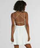 The Whimsical Beauty Strappy Back Textured Knit Skater Dress is a mini dress in white, perfect for an above-the-knee holiday party dress or a stylish NYE look, with a short hemline designed to make a winter statement.