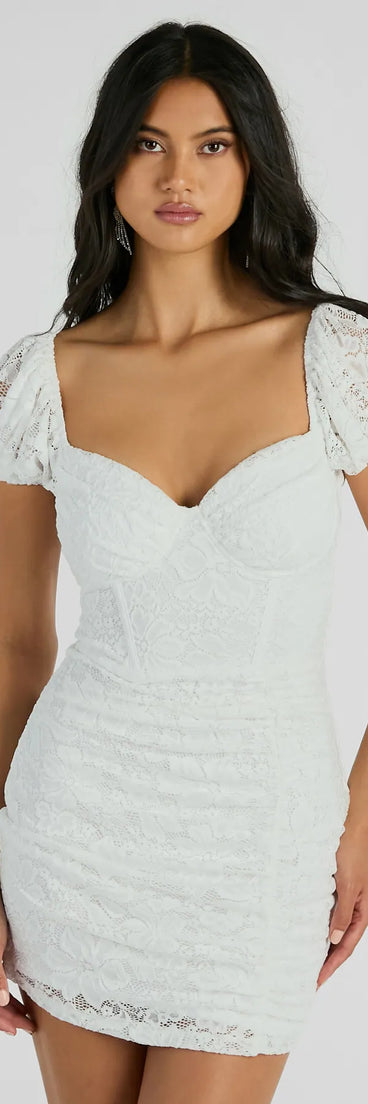 Step into winter chic with the Delicate Essence Puff Sleeve Corset Lace Mini Dress, a white mini dress featuring an above-the-knee cut ideal for cocktail parties, festive gatherings, or clubwear.