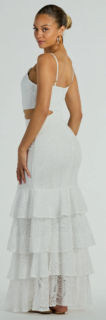 Essential for vacations or summer days, the Free Flowing Cutie V-Neck Ruffle Eyelet Maxi Dress is a sundress or milkmaid dress with sleek and flirty details.